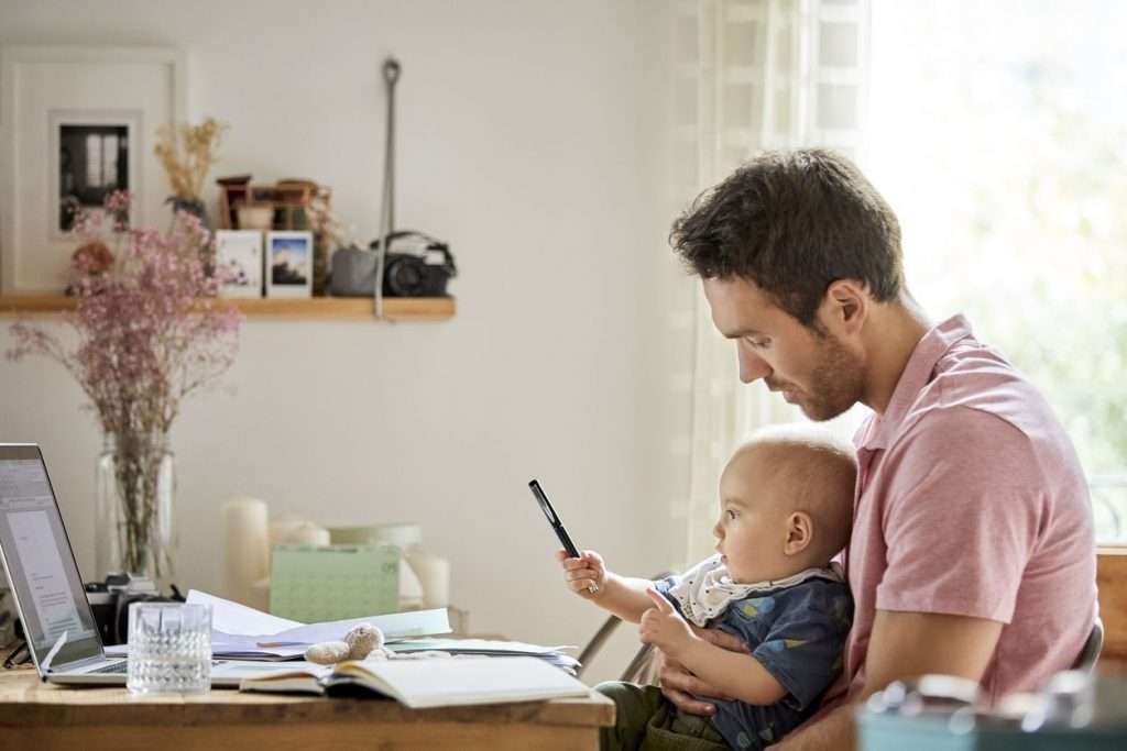 Father with child reviewing energy proposals
